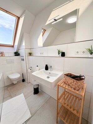 Shower, hair dryer, towels, soap