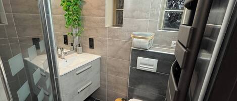 Shower, hair dryer, towels, toilet paper
