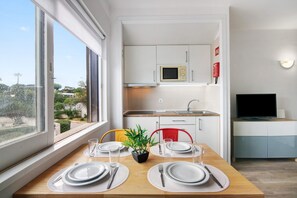 Fridge, microwave, stovetop, coffee/tea maker