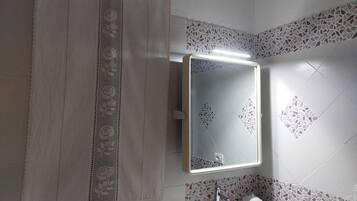 Shower, bidet, towels, soap