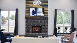Smart TV, fireplace, books