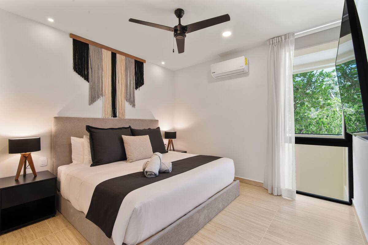 Deluxe Apartment, Balcony | 2 bedrooms, in-room safe, individually decorated, iron/ironing board