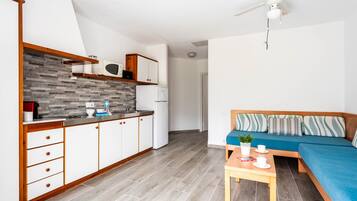 Fridge, microwave, stovetop, coffee/tea maker