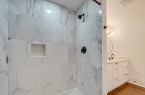 Shower, towels, soap, toilet paper