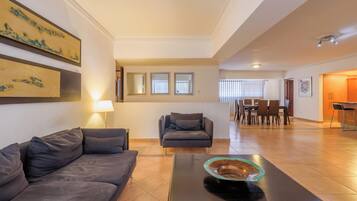 Classic Apartment, 3 Bedrooms, City View, Tower | Living area | 55-inch Smart TV with cable channels