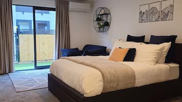 1 bedroom, desk, iron/ironing board, travel crib