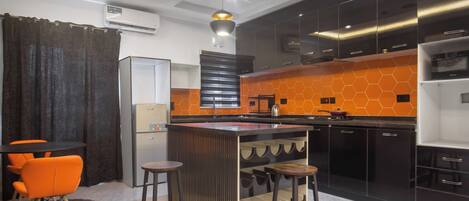 Fridge, microwave, cookware/dishes/utensils, spices