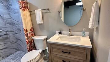 Shower, towels, soap, toilet paper