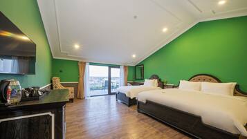 Deluxe Triple Room, Balcony, Beach View | Memory-foam beds, in-room safe, blackout curtains, soundproofing