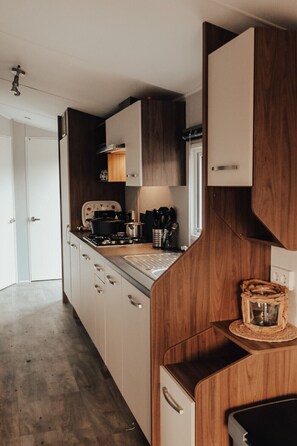 Fridge, coffee/tea maker, cookware/dishes/utensils