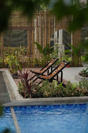 Outdoor pool, pool umbrellas, sun loungers