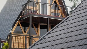 A modern building with a triangular roof and a balcony. - Fairyland Resort (Kodaikanal)