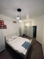 Economy Room, 4 Bedrooms | Premium bedding, in-room safe, free WiFi, bed sheets