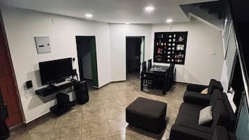Habitación económica, 4 habitaciones | Zona de estar