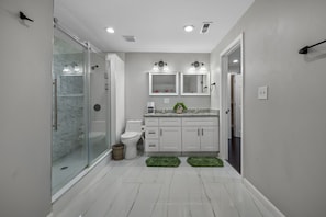 Shower, hair dryer, towels, soap