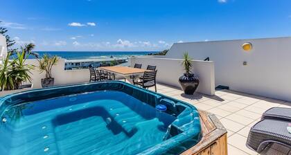 Luxe Oceanfront Haven with a Rooftop Spa