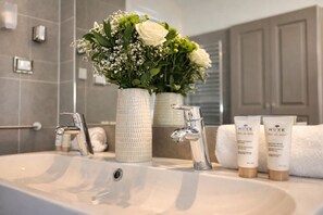 Shower, hair dryer, towels, soap