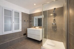 Shower, hair dryer, towels, soap