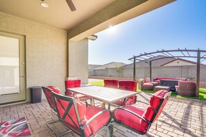 Relax in style on this outdoor patio with a comfortable table and six chairs.