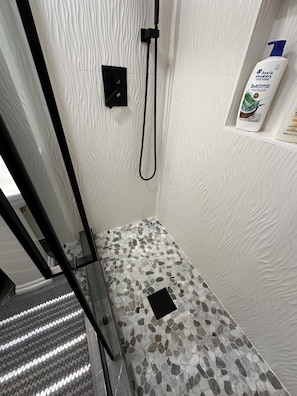 Shower, hair dryer, towels, soap