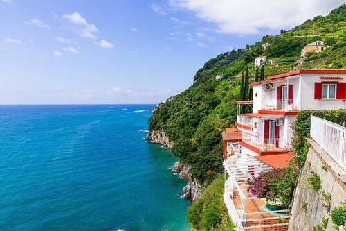 Villa Furina: A bright and sunny four-story villa built on the sloping cliff in front of the sea, with Free WI-FI.