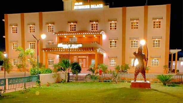 A building with a sign reading "Sunshine Palace" and a statue in front. - Avadh Sunshine Palace Hotel & Resort (Tarabganj)
