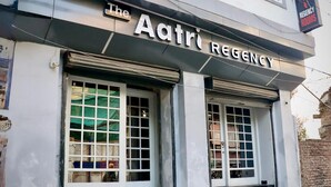 The Aatri Regency building facade with large windows and a sign above the entrance. - The Aatri Regancy By GRB (Amritsar)