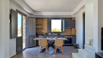 Aegean suite with Sea View | Living area | 42-inch Smart TV with digital channels