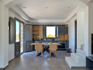 Aegean suite with Sea View | Living area | 42-inch Smart TV with digital channels