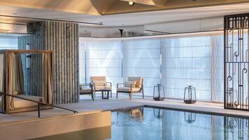 Indoor pool, pool loungers, lifeguards on site