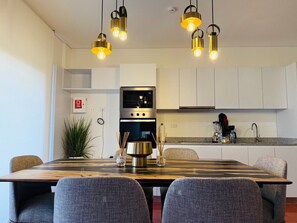 Fridge, oven, coffee/tea maker, cookware/dishes/utensils