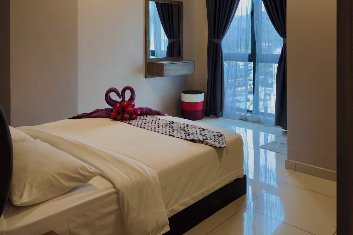 A modern hotel room with a large bed, a bedside table, a mirror, a window with curtains, and a ceiling fan.