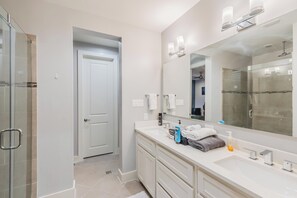 Shower, hair dryer, towels, soap