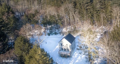 Brand new family home nestled in the woods close to Waterbury, Stowe, and Sugarbush with a hot tub