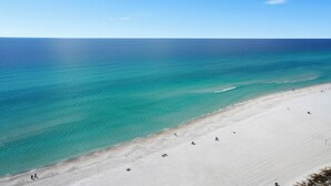 A beach with clear turquoise water and a sandy shore. - Sea and Ski: 1BR+ Bunk/2BA, Direct Gulf Views! Shores of Panama (Panama City Beach)