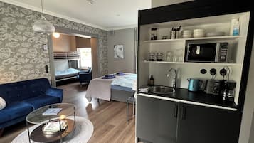 Deluxe Quadruple Room, City View | Individually decorated, individually furnished, blackout drapes