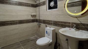 Bidet, towels, soap, toilet paper