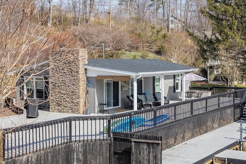 Charming lakefront retreat with spacious deck, private dock, and serene views—perfect for relaxation