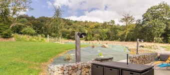 Bright family home with spa, private garden and children's games.