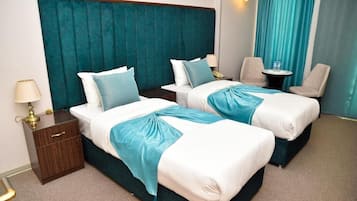 Luxury Room, City View | Desk, blackout curtains, iron/ironing board, free WiFi