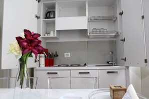 Microwave, stovetop, coffee/tea maker, cookware/dishes/utensils