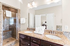 Shower, hair dryer, towels, shampoo