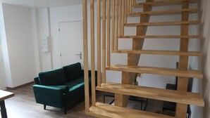 A staircase with wooden steps and a wooden railing.