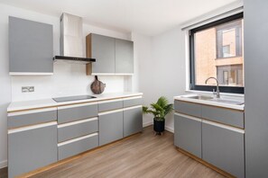 Quarto solteiro, para não fumantes | Cozinha compartilhada