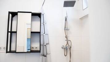 Shower, towels, soap, toilet paper