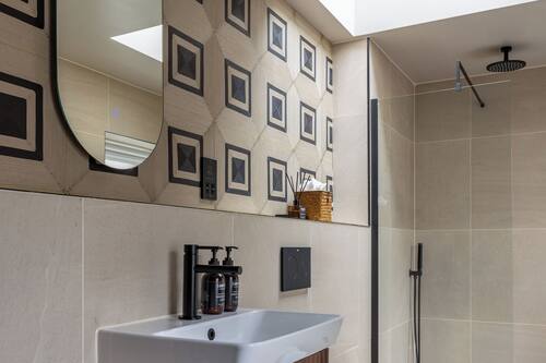 Queen Charlotte | Bathroom | Designer toiletries, hair dryer, bathrobes, towels