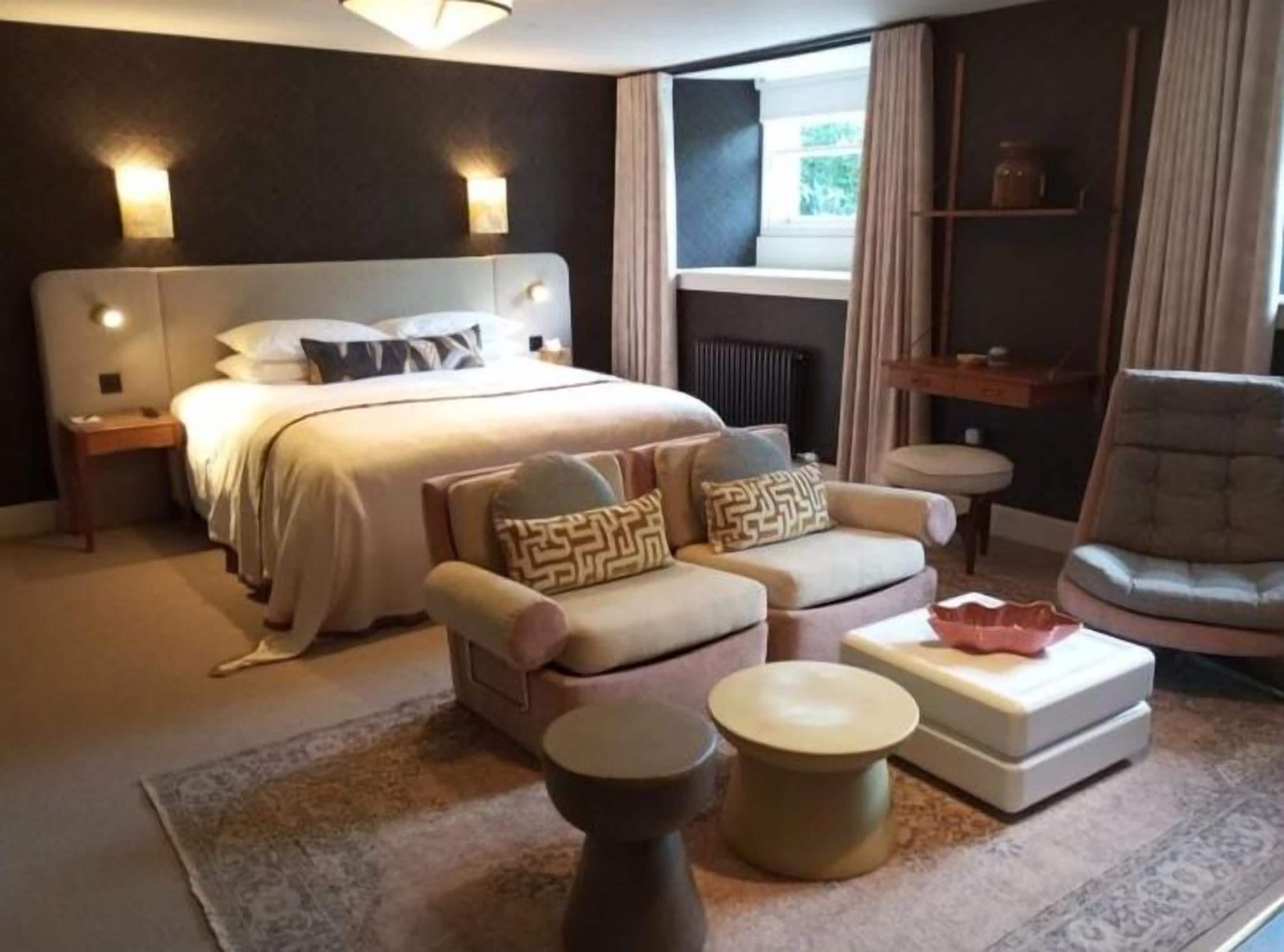 Signature studio suite, uitzicht op tuin | Luxe beddengoed, pillowtop-bedden, individueel gedecoreerd