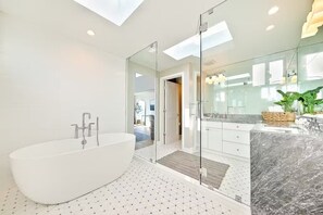 Shower, hair dryer, towels, shampoo
