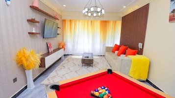Classic Apartment | Living area | 50-inch Smart TV with cable channels, Netflix, first-run movies