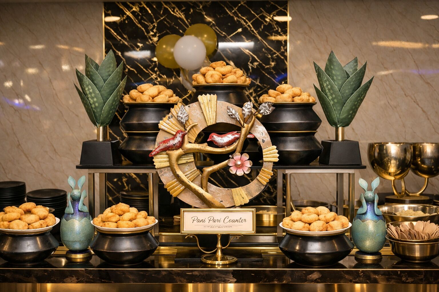 A buffet setup with multiple bowls of food, a decorative centerpiece, and a sign indicating 'Fani Paru Coanier.'